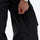 Unisex waterproof 3L bib snow pants - black, leg zip close-up with hand, for skiing and snowboarding
