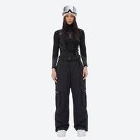 
                  
                    Unisex bib snowboard pants with snow gaiters - black bib snow pants with black top, for powder and piste riding
                  
                