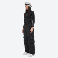 
                  
                    Unisex bib snowboard pants with snow gaiters - black bib snow pants with black top, for resort and backcountry days
                  
                