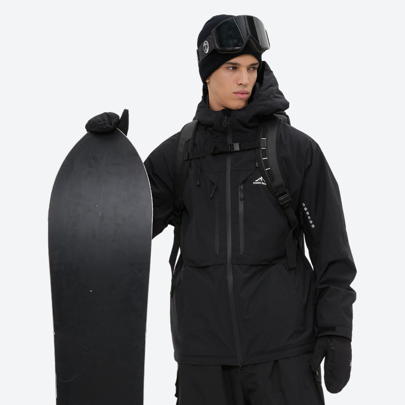 Men's 3-layer snowboard jacket and pants - black, on-model front with snowboard and backpack, for powder and piste riding