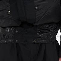 
                  
                    Men's waterproof 3L snow jacket and pants series - black, inner snow skirt close-up detail, for skiing and snowboarding
                  
                