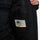 Men's 3-layer snowboard jacket and pants - black, interior pocket label close-up detail, for powder and piste riding