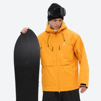 
                  
                    Men's breathable ski jacket and pants set - amber orange, on-model front with upright snowboard, for powder and piste riding
                  
                