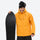 Men's breathable ski jacket and pants set - amber orange, on-model front with upright snowboard, for powder and piste riding