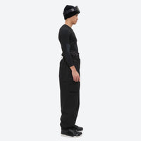 
                  
                    Men's 3-layer snowboard jacket and pants - black bib pants, on-model side view, for powder and piste riding
                  
                