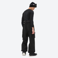 
                  
                    Men's waterproof 3L snow jacket and pants series - black bib pants, side view leaning forward, for cold-weather winter sports
                  
                