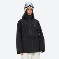 
                  
                    Women's 3-layer snowboard jacket and pants - black jacket, on-model front view, for skiing and snowboarding
                  
                