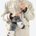 Insulated snow mittens for cold resort days - gray snow mittens on model in beige jacket, for snow sports weekends