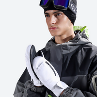 
                  
                    Waterproof winter mittens with touchscreen fingertips - white snow mittens on men with goggles beanie, chest wear view
                  
                