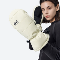 
                  
                    Snow mittens with touchscreen fingertips - cream snow mittens on model, women wear view, for snow sports weekends
                  
                