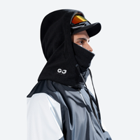 
                  
                    Ski hood facemask with adjustable drawcord - black fleece hood facemask on men with cap and goggles, worn side view
                  
                