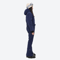 
                  
                    Women's breathable 3-layer jumpsuit ski suit - navy one-piece snow suit, on-model side view, for cold-weather winter sports
                  
                