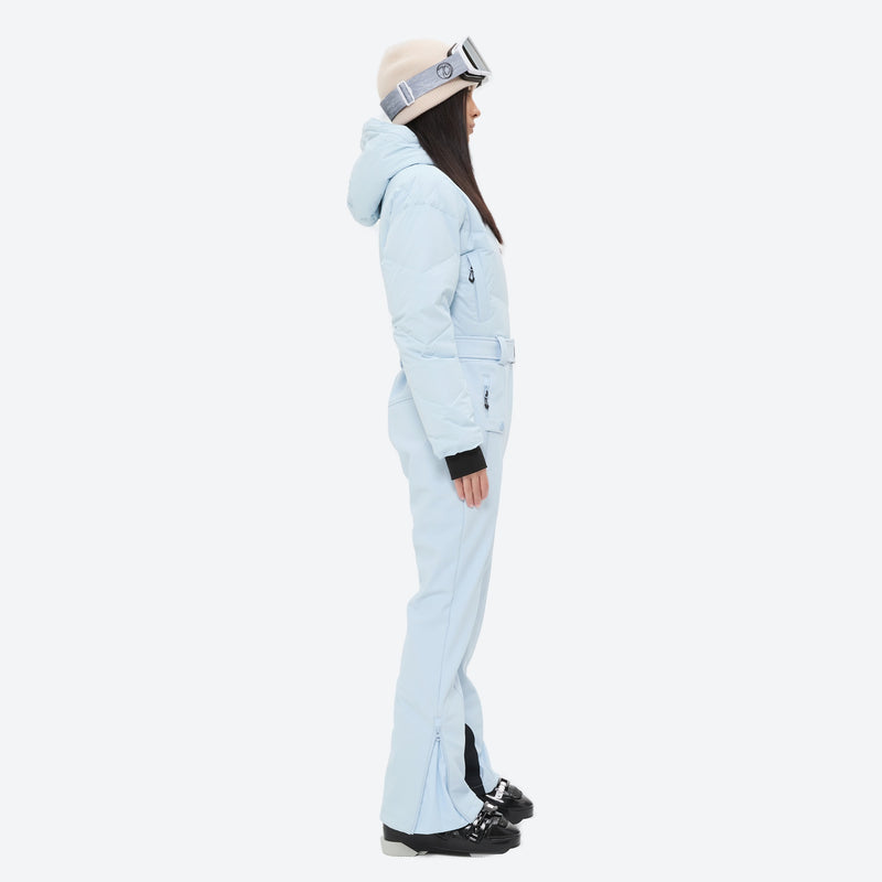 Women's breathable 3-layer jumpsuit ski suit - ice blue one-piece snow suit, on-model side view, for powder and piste riding