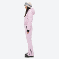 
                  
                    Women's breathable 3-layer jumpsuit ski suit - pink one-piece snow suit, on-model side view, for skiing and snowboarding
                  
                