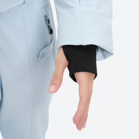 
                  
                    Women's waterproof 3L one-piece snow suit - ice blue, cuff thumbhole close-up with hand, for powder and piste riding
                  
                