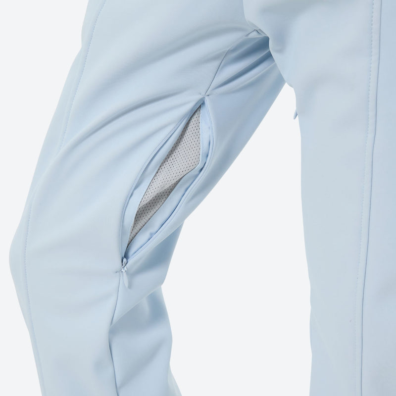 Women's waterproof 3L one-piece snow suit - ice blue, thigh zip vent open close-up detail, for resort and backcountry days