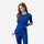 Warm merino wool baselayer suit for snow sports - blue merino compression base layer suit on women, front view pulling hem