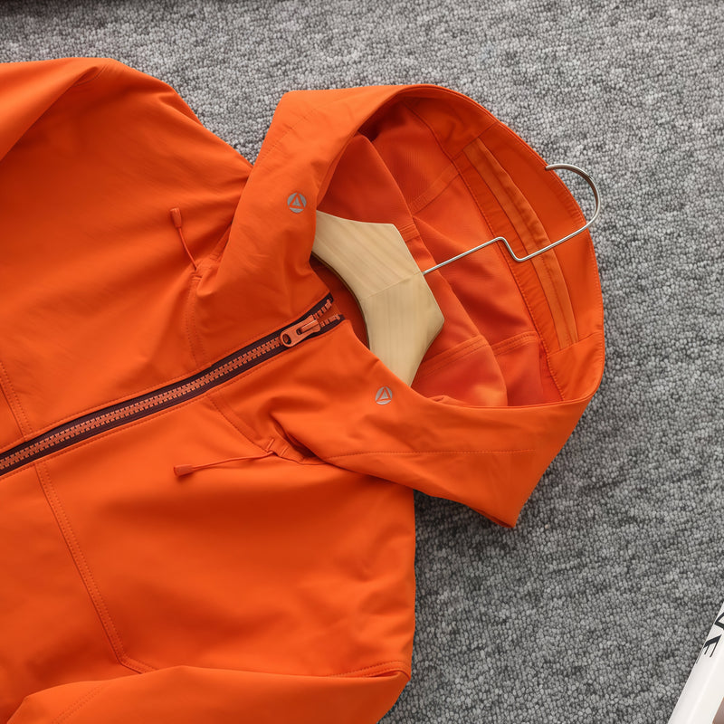 Women's light water-repellent hiking jacket - orange softshell jacket, flat lay hood close-up, for hiking and trekking