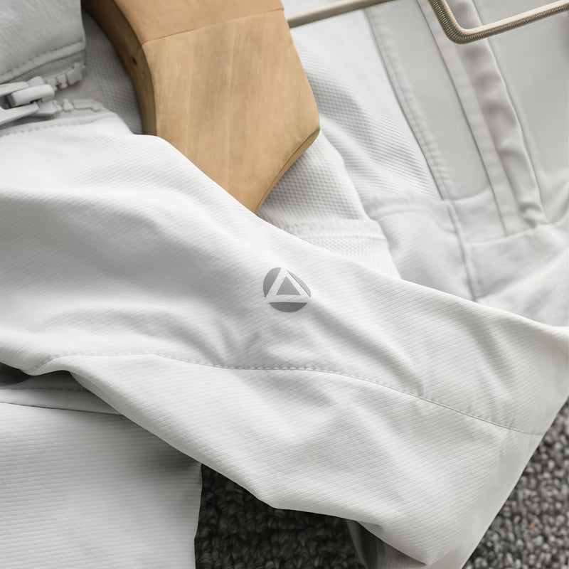 Men's lightweight stretch softshell jacket - white, cuff logo close-up detail, for travel and city commute