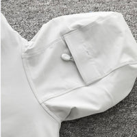 
                  
                    Men's waterproof softshell jacket - white, hood snap close-up detail, for camping and outdoor wear
                  
                
