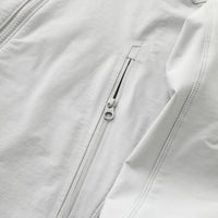 
                  
                    Men's lightweight stretch softshell jacket - white, side zip pocket close-up detail, for hiking and trekking
                  
                