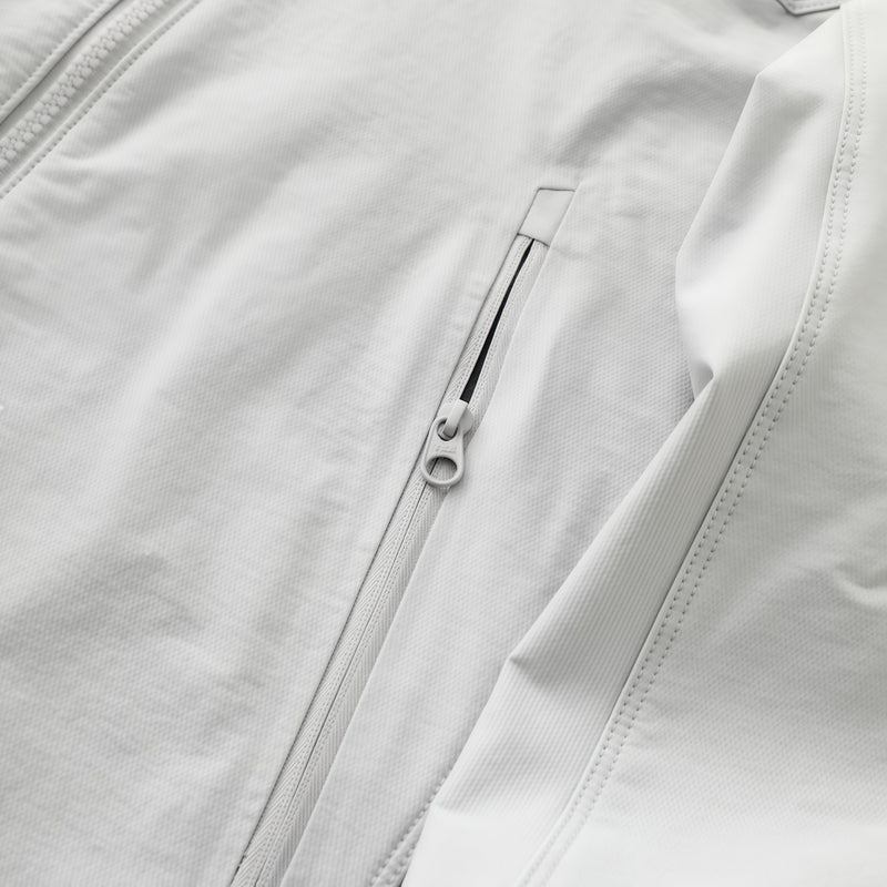 Men's lightweight stretch softshell jacket - white, side zip pocket close-up detail, for hiking and trekking