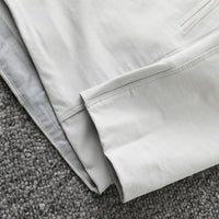 
                  
                    Men's waterproof softshell jacket - white, hem interior close-up detail, for travel and city commute
                  
                