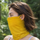 Cocoon merino wool facemask and neckwarmer with ear loops - yellow merino wool facemask on women, worn side view
