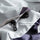 Unisex waterproof jacket with cape back vent - light gray, hidden pocket buckle close-up, for skiing and snowboarding