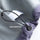 Breathable rain shell with extended hood brim - light gray, adjustable hem drawstring close-up, for hiking and travel