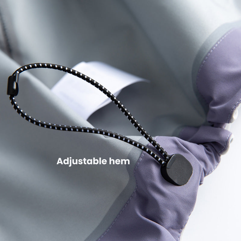 Breathable rain shell with extended hood brim - light gray, adjustable hem drawstring close-up, for hiking and travel