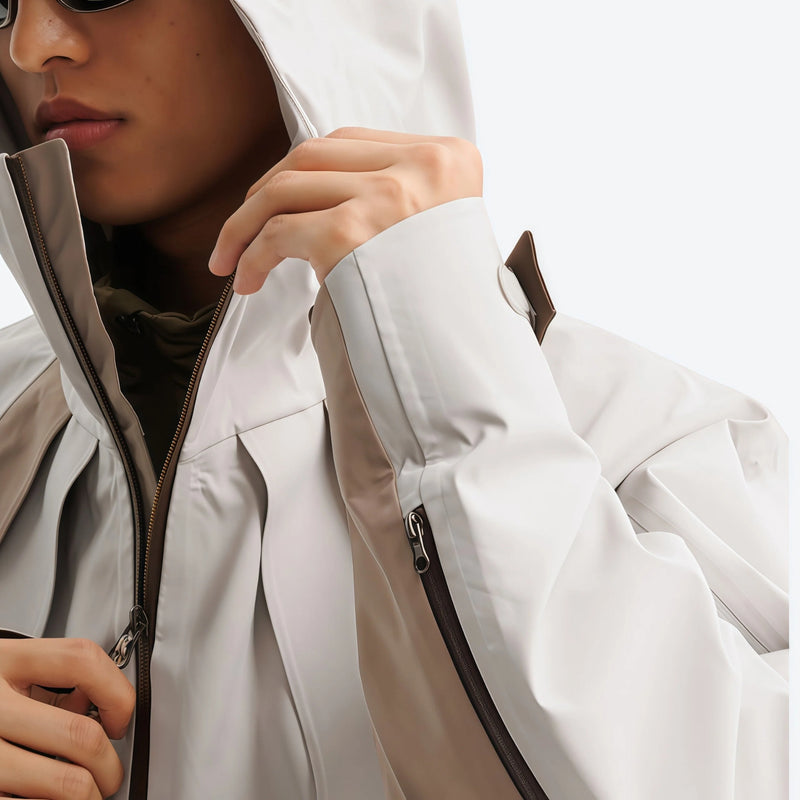 Unisex waterproof jacket with cape back vent - beige gray, collar close-up with hand, for resort and street wear
