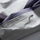Unisex waterproof jacket with cape back vent - light gray, zip pocket close-up detail, for hiking and travel