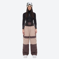 
                  
                    Unisex 3-layer snowboard jacket and pants - tan and black colorblock snow pants with black top, on-model front view
                  
                