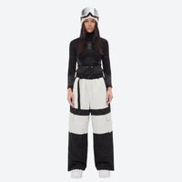
                  
                    Unisex waterproof 3L snow jacket and pants series - white and black colorblock snow pants with black top, on-model front view
                  
                