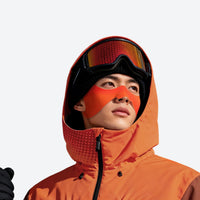 
                  
                    Cold weather face patches with ear loops - orange face patch on men in orange jacket with goggles, for snow sports weekends
                  
                