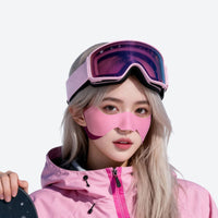 
                  
                    Cozy winter face patches for cheek and nose protection - pink face patch on women in pink jacket with goggles
                  
                