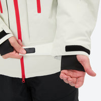 
                  
                    Unisex 3-layer snowboard jacket and pants - white jacket, cuff strap close-up with hand, for powder and piste riding
                  
                
