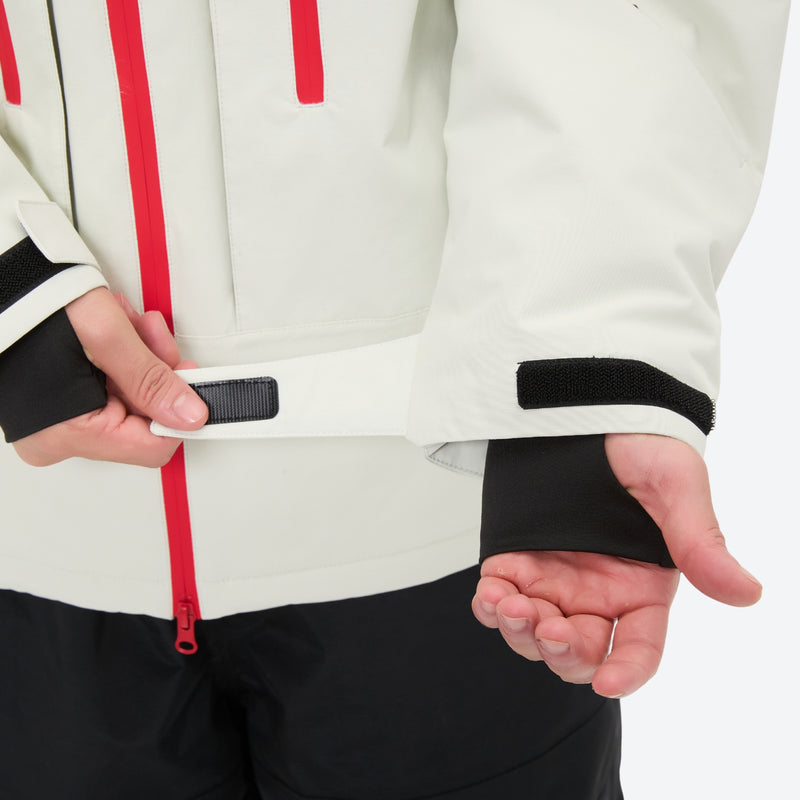 Unisex 3-layer snowboard jacket and pants - white jacket, cuff strap close-up with hand, for powder and piste riding