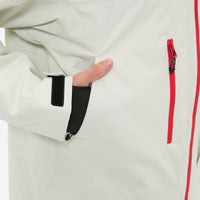 
                  
                    Unisex 3-layer snowboard jacket and pants - white jacket, side pocket close-up with hand, for cold-weather winter sports
                  
                