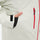 Unisex 3-layer snowboard jacket and pants - white jacket, side pocket close-up with hand, for cold-weather winter sports