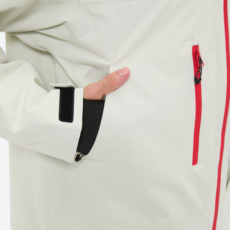 Unisex 3-layer snowboard jacket and pants - white jacket, side pocket close-up with hand, for cold-weather winter sports