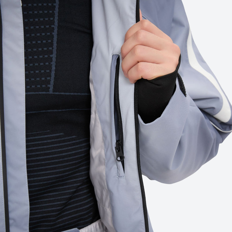Men's 3-layer snowboard jacket and pants - light gray gradient, chest zip close-up with hand, for powder and piste riding