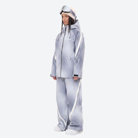 
                  
                    Women's 3-layer snowboard jacket and pants - lavender gradient jacket with lavender gradient pants, on-model side view
                  
                
