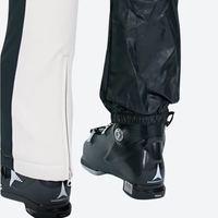 
                  
                    Women's adjustable ski pants with inner snow skirt - cream ski pants, hem snow skirt close-up with boot, for resort ski days
                  
                