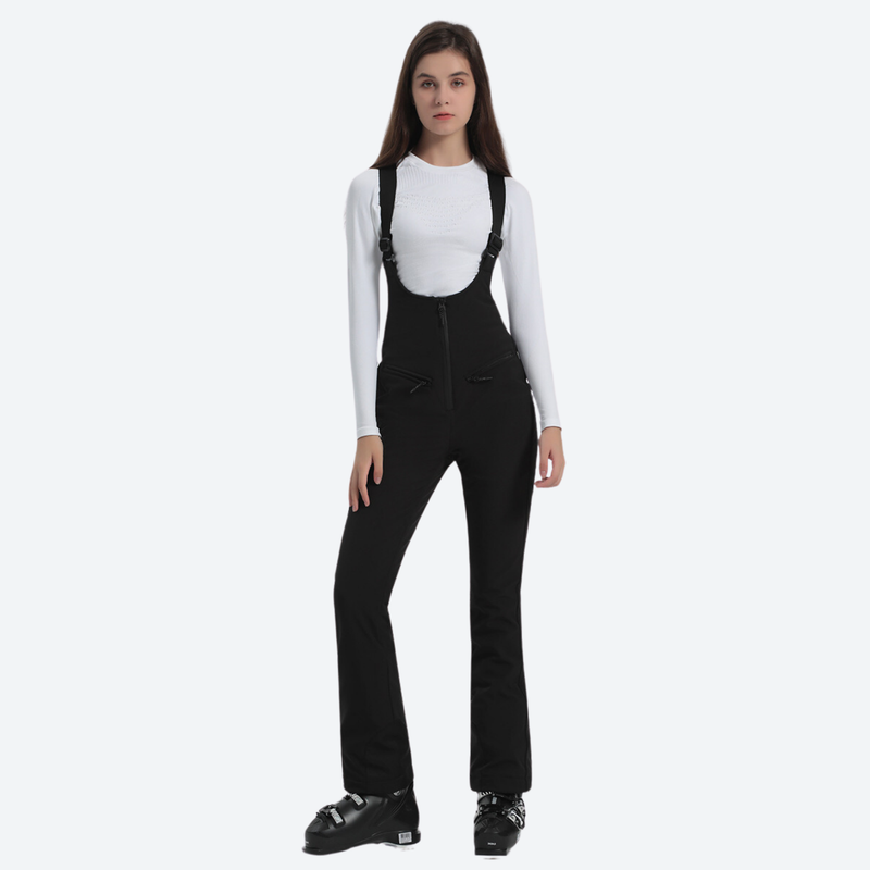 Women's slim ski bib with inner snow skirt - black slim fit ski bib, front standing view, for skiing and snowboarding
