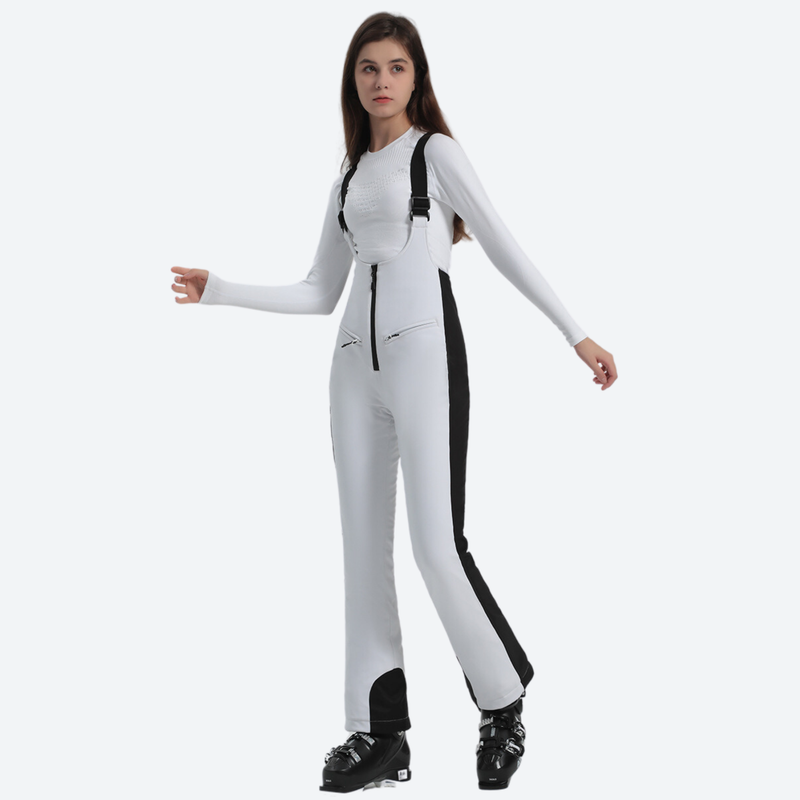 Women's stretchable ski bib with adjustable suspenders - white slim fit ski bib with black side stripe, walking side view