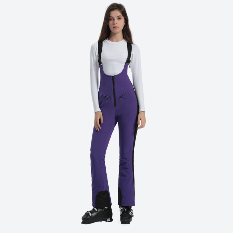 Women's slim ski bib with inner snow skirt - purple slim fit ski bib, front three-quarter view, for snow sports weekends