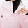 Women's breathable ski jacket set in pastel colors - light pink, collar close-up with hand, for powder and piste riding