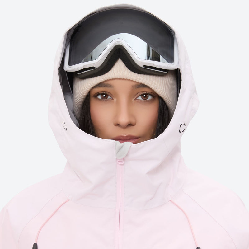 Women's 3-layer snowboard jacket and pants - light pink, hood and face close-up with goggles, for skiing and snowboarding